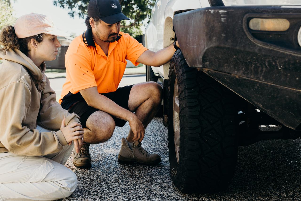 Professional mechanic inspecting vehicle during Car4Travel check